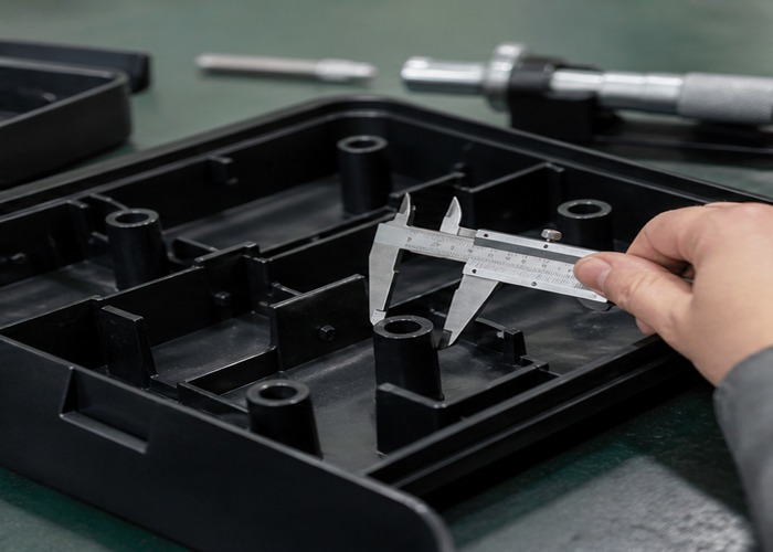 Injection Molding inspection detail scene in a modern manufacturing workshop
