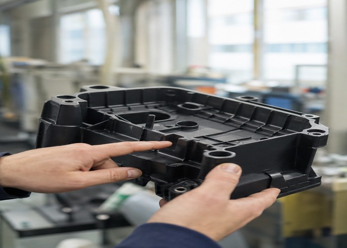 Injection Molding inspection detail scene in a modern manufacturing workshop