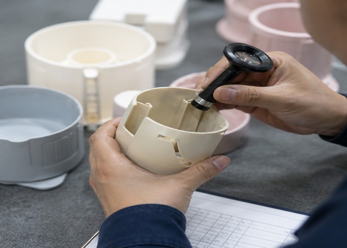Injection Molding inspection detail scene in a modern manufacturing workshop