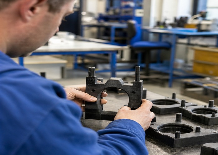 3D Printing final review scene in a modern manufacturing workshop