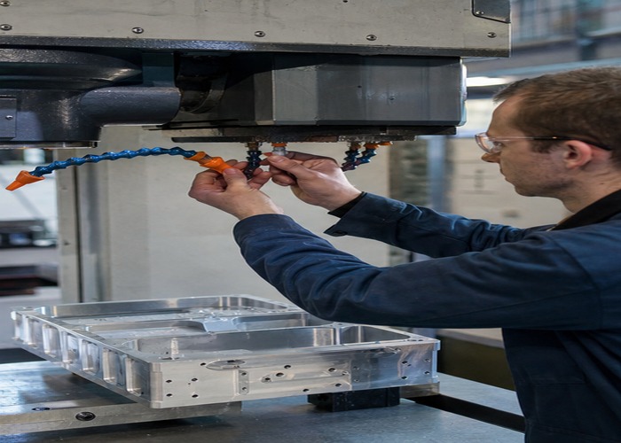 CNC Machining final review scene in a modern manufacturing workshop