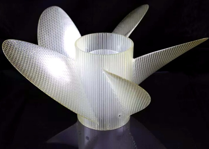3D Printing final review scene in a modern manufacturing workshop