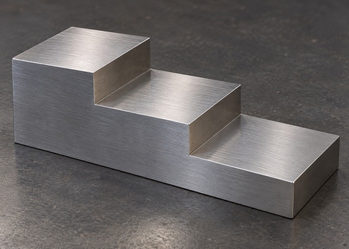 Metal reference block with three flat thickness steps