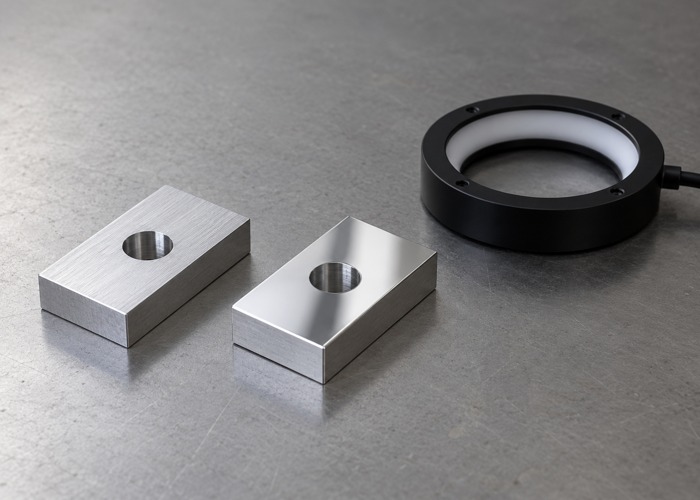 Matte and polished metal coupons beside a ring illuminator