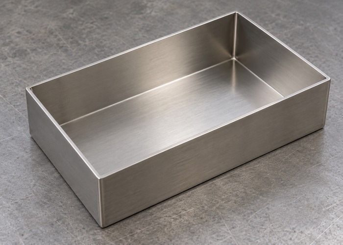 Open sheet metal tray showing accessible interior corners