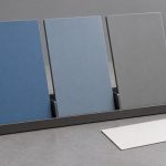 Blue and gray coated metal swatches in a rack